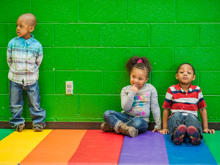 3 kids on playmat