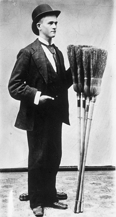 mr kellogg with a broom