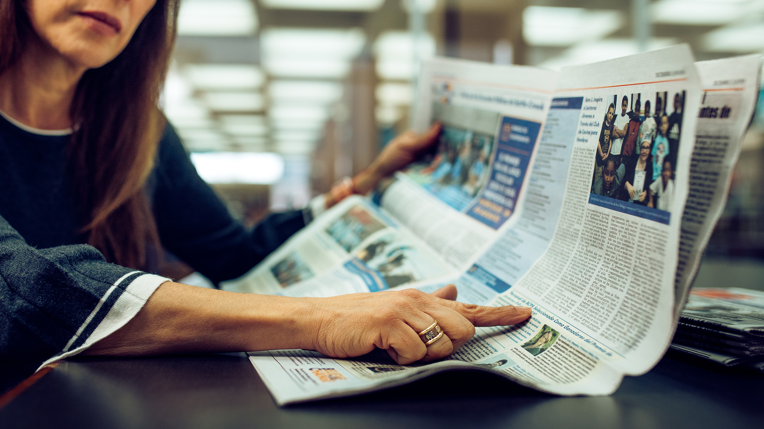 woman holding newspaper
